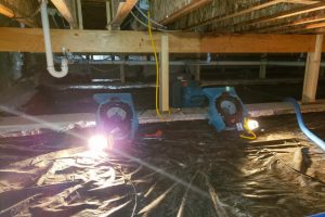 Water damage crawl space with blowers to dry it out